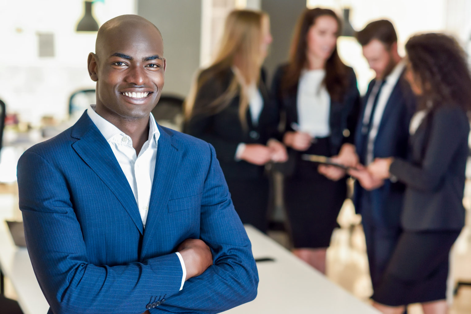 businessman leader in modern office with businesspeople working