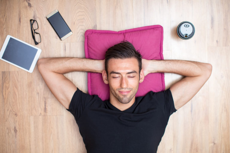 content handsome man lying floor relaxing